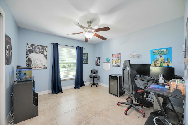 tiled home office featuring ceiling fan