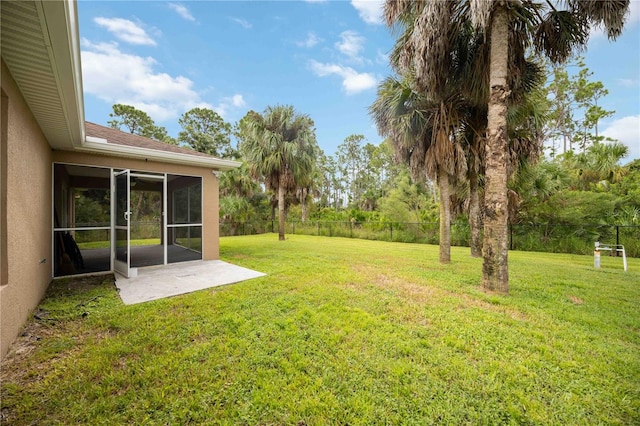 view of yard with a patio area and a sunroom