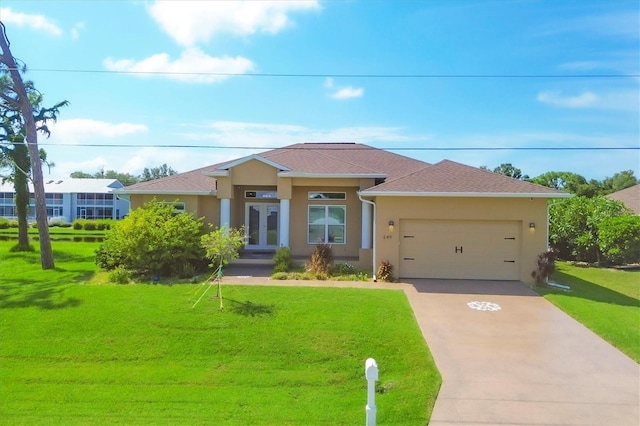 view of front of house with a garage and a front lawn