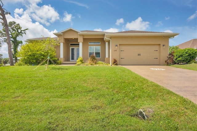 view of front of house featuring a front yard and a garage