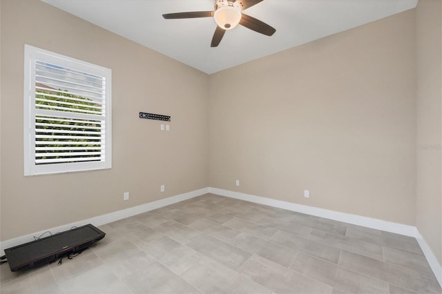 spare room with ceiling fan