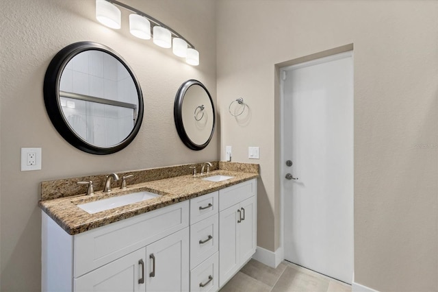 bathroom featuring vanity and tile patterned flooring