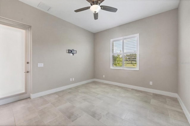 spare room with ceiling fan