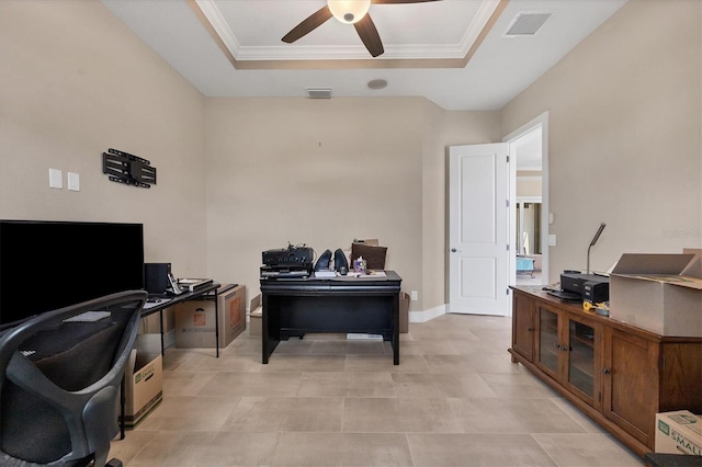 office space with a tray ceiling, ceiling fan, and crown molding