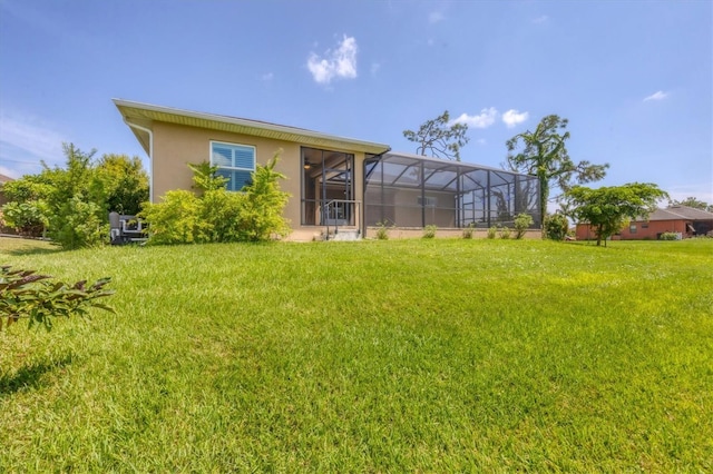 view of yard with glass enclosure