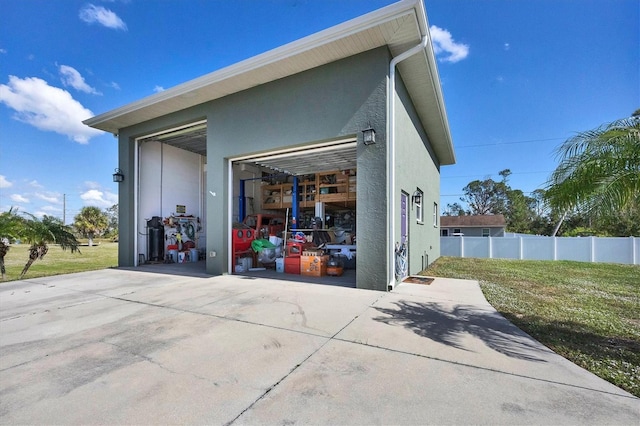 garage featuring a yard