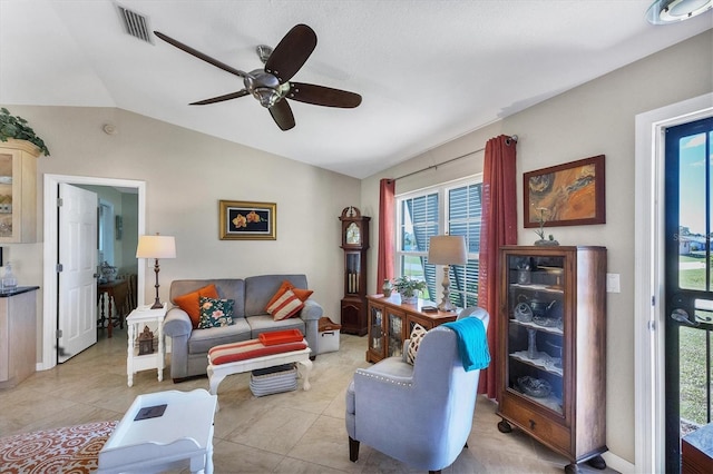 tiled living room with lofted ceiling and ceiling fan