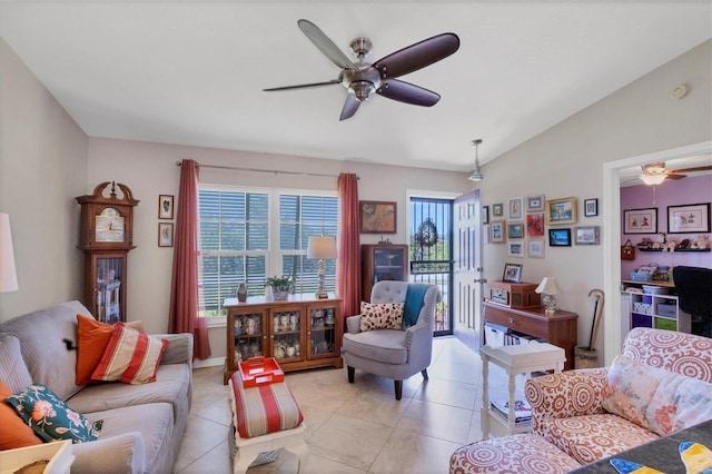 tiled living room featuring vaulted ceiling and ceiling fan