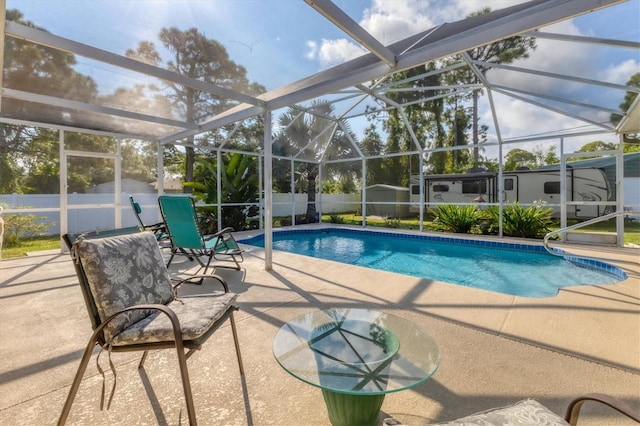 view of pool with a lanai and a patio area