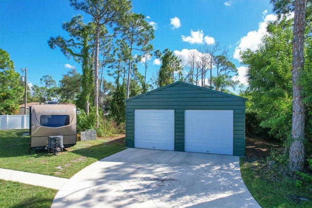 garage featuring a yard