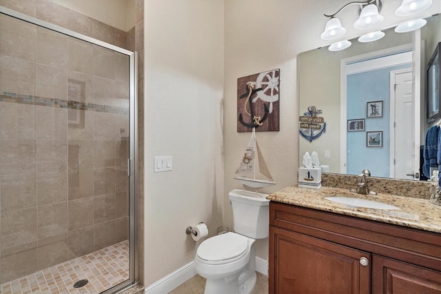 bathroom featuring walk in shower, vanity, and toilet