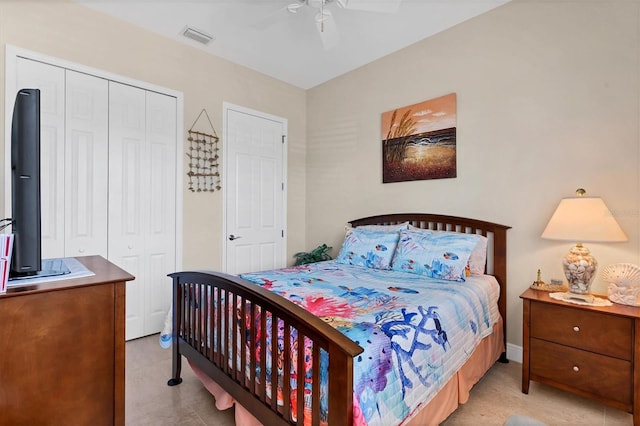 bedroom with ceiling fan and a closet