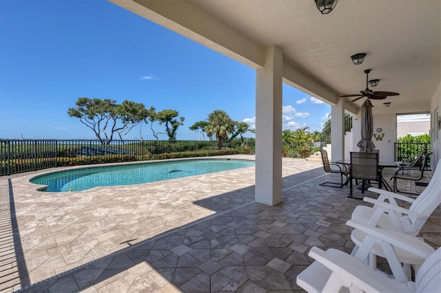 view of pool with ceiling fan and a patio area