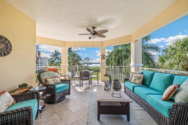 view of patio with outdoor lounge area and ceiling fan