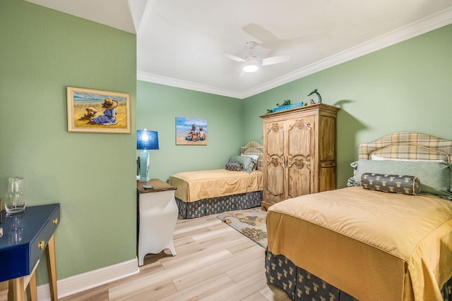 bedroom with light wood-type flooring, ceiling fan, and crown molding