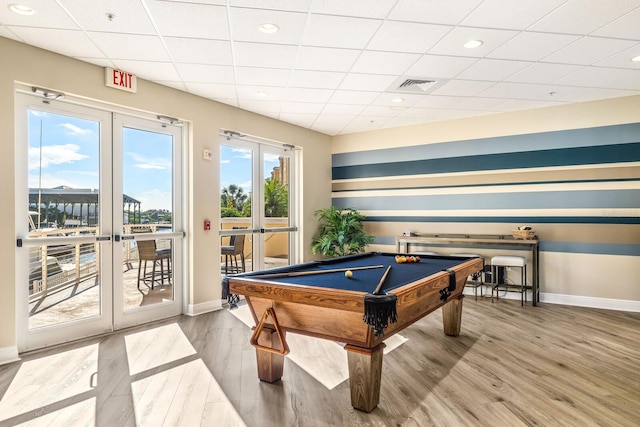 rec room featuring pool table, hardwood / wood-style flooring, and french doors