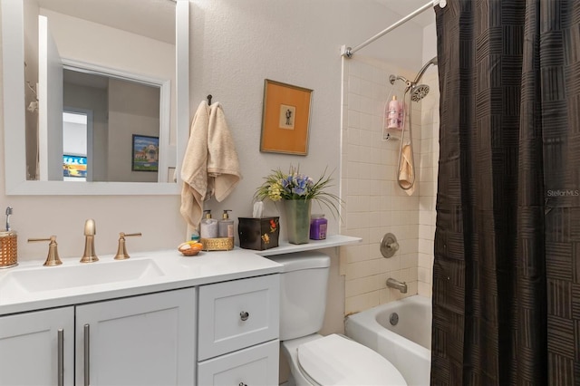 full bathroom with vanity, shower / tub combo, and toilet