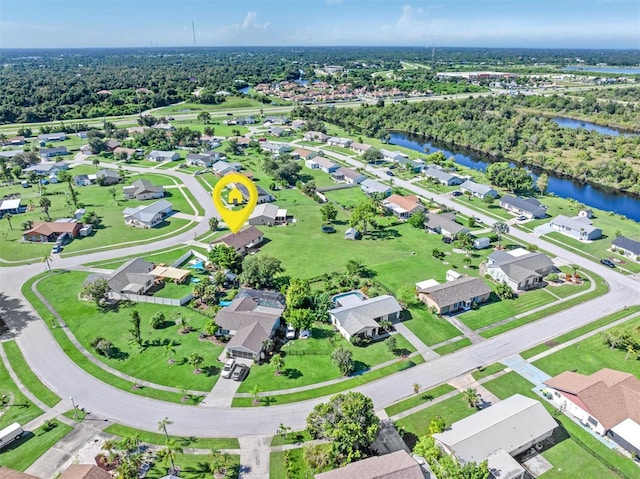 bird's eye view featuring a water view and a residential view