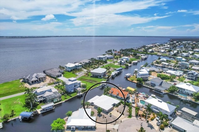 birds eye view of property featuring a water view