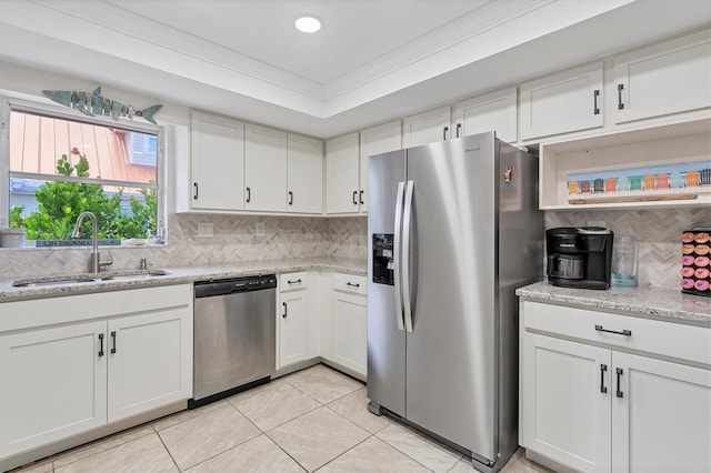 kitchen featuring white cabinets, appliances with stainless steel finishes, and sink