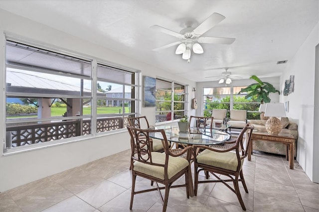 sunroom with ceiling fan