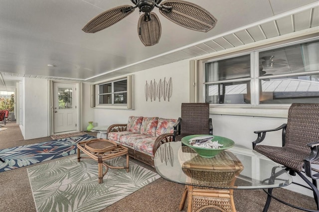 sunroom / solarium featuring ceiling fan