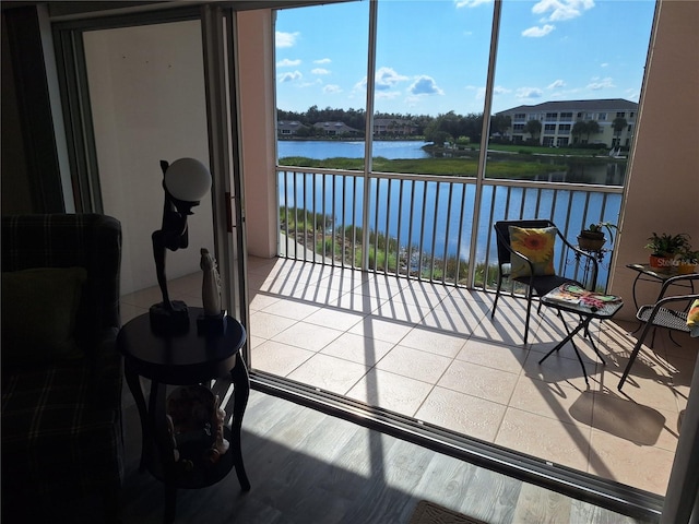 sunroom / solarium with a water view