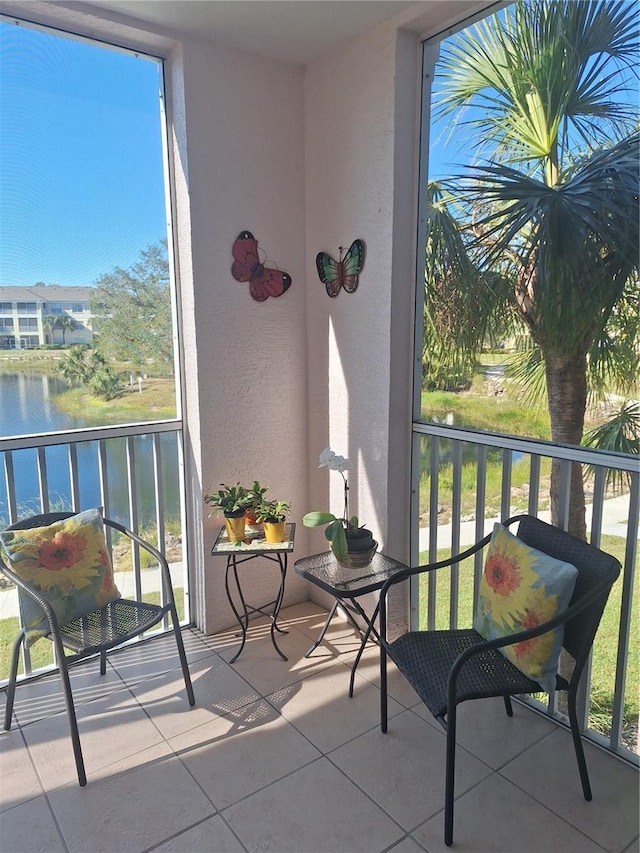 balcony featuring a water view