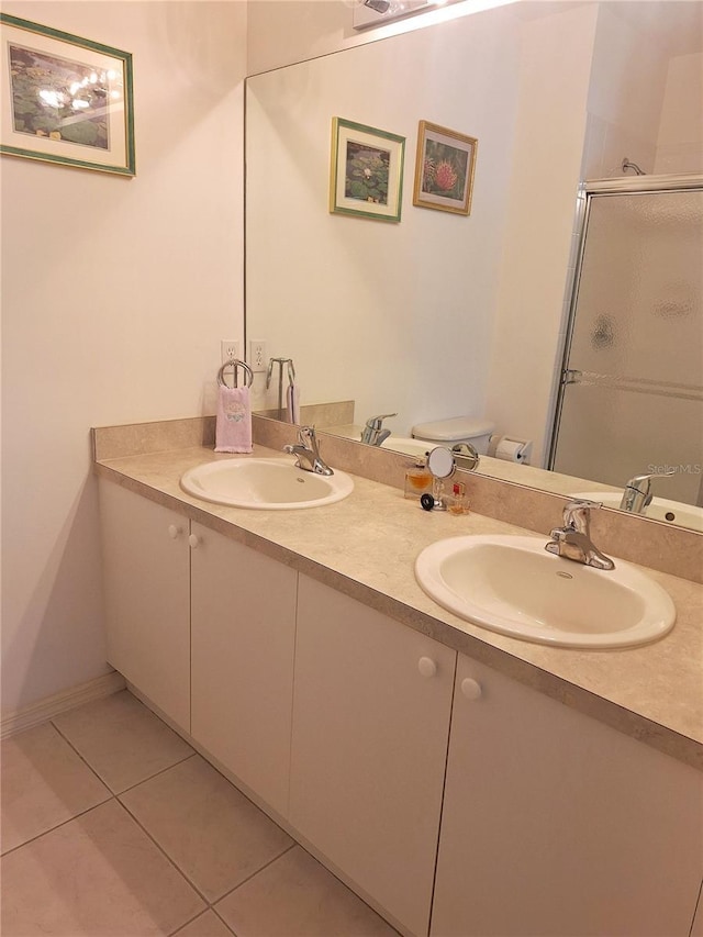 bathroom with walk in shower, tile patterned flooring, vanity, and toilet