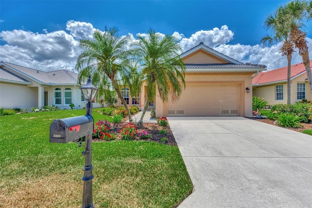 view of front of property with a front lawn and a garage