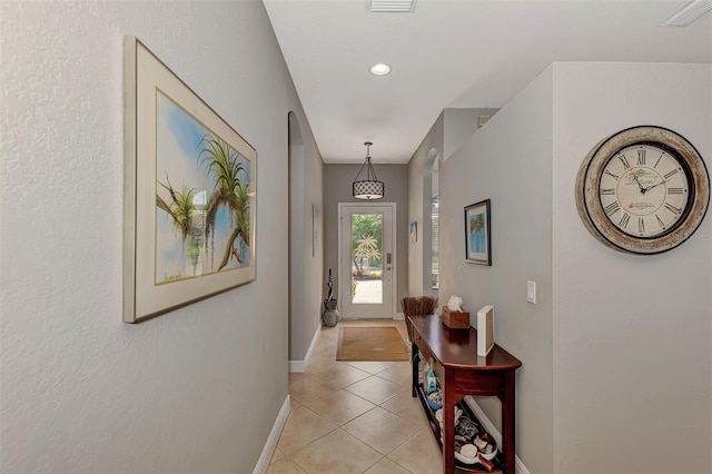 doorway featuring light tile patterned floors