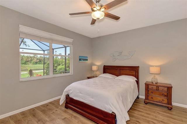 bedroom with light hardwood / wood-style flooring and ceiling fan