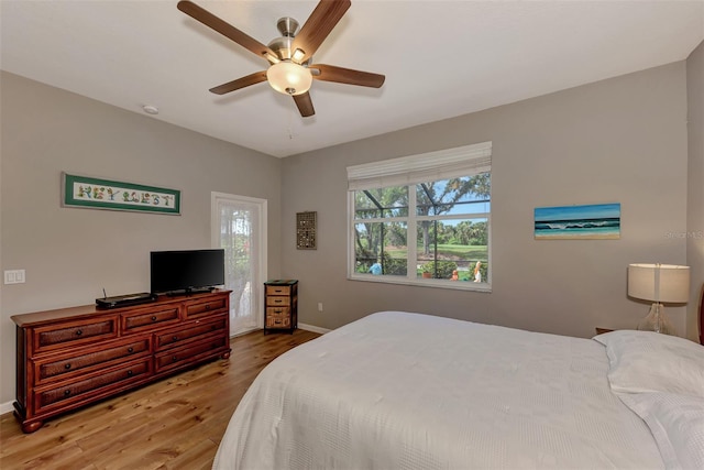 bedroom featuring hardwood / wood-style floors and ceiling fan