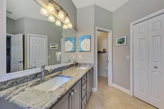 bathroom with vanity and tile patterned floors