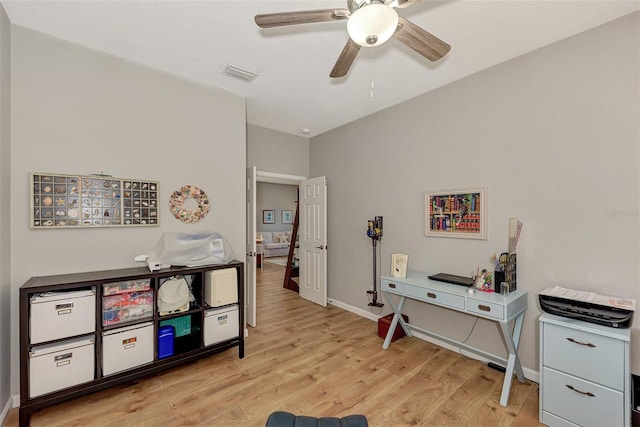 office space with ceiling fan and light hardwood / wood-style flooring