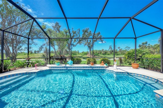 view of pool with a lanai and a patio area