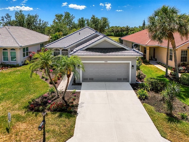 view of front of house with an attached garage, a tiled roof, stucco siding, a front lawn, and driveway