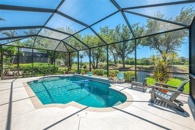 outdoor pool featuring a patio area and a lanai
