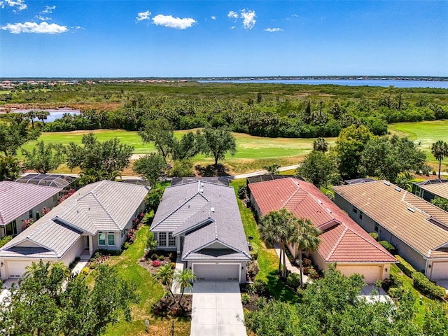 birds eye view of property featuring a water view, golf course view, and a residential view