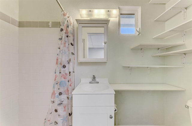 bathroom with vanity and curtained shower