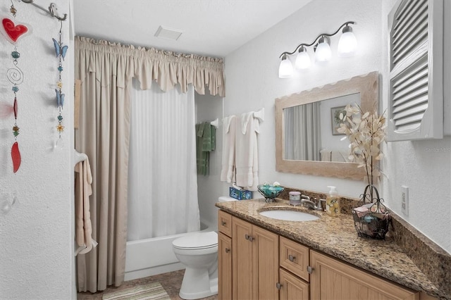 full bathroom featuring shower / bath combo, vanity, and toilet