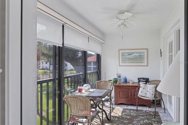 sunroom with a wealth of natural light and ceiling fan