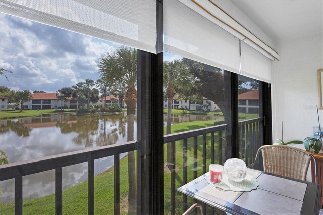 sunroom with a water view