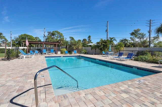 view of pool featuring a pergola and a patio