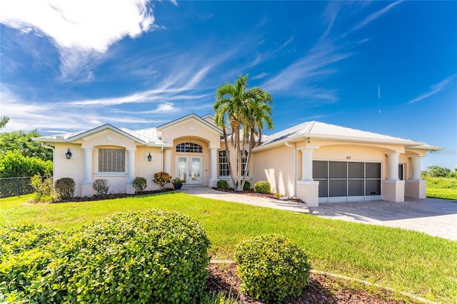 ranch-style home with a front yard