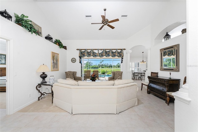 living room with high vaulted ceiling, ceiling fan, and light tile patterned floors