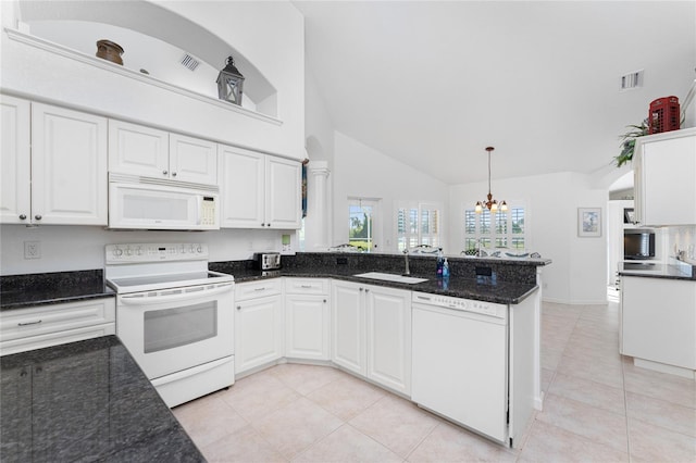 kitchen with white cabinetry, white appliances, kitchen peninsula, decorative light fixtures, and sink