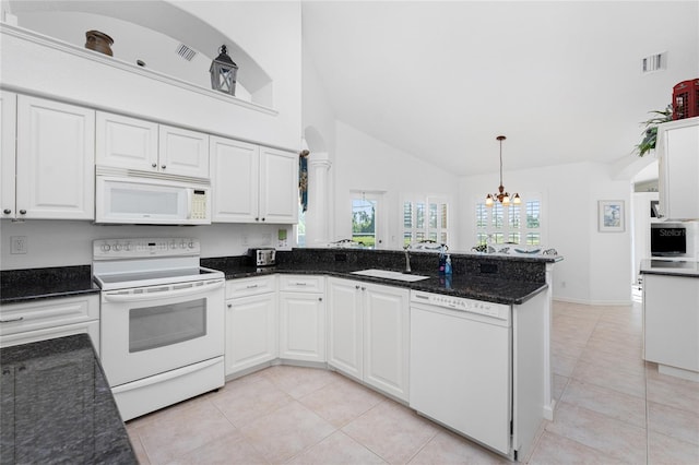 kitchen with white cabinets, white appliances, and sink