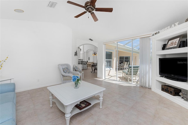 unfurnished living room with light tile patterned floors, ceiling fan, and built in features