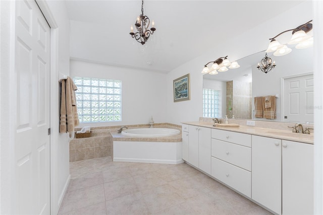 bathroom featuring a notable chandelier, shower with separate bathtub, vanity, and tile patterned floors